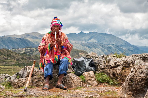 Old Man playing music in Quena. Cusco, Peru.