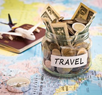 map with money jar for travel