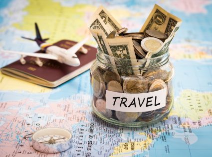 map with money jar for travel